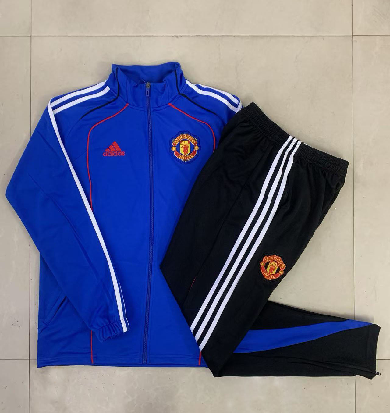 Tuta Manchester United blu zip intera 2025/26
